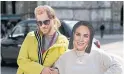  ?? ?? Production staff wear masks of Britain's Prince Harry and fiancée Meghan Markle as they film in London.