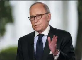  ?? CAROLYN KASTER — THE ASSOCIATED PRESS ?? White House chief economic adviser Larry Kudlow speaks during a television interview outside the West Wing of the White House, in Washington, Friday.