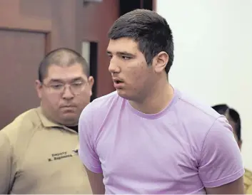  ?? DEAN HANSON/JOURNAL ?? Joshua Owen, 16, enters the courtroom for his first appearance in 13th Judicial District Court in Sandoval County on Monday morning. Owen is charged with three counts of attempted murder involving a shooting at Cleveland High School last week.