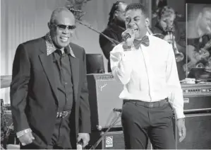  ?? SAUL LOEB, AFP/GETTY IMAGES Sam Moore, left, and Joshua Ledet perform the Sam & Dave hit
Soul Man in the East Room of the White House. ??