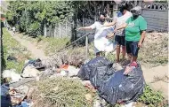  ??  ?? LEFT: Prabashnee Reddy, left, Alice Govender and Dhanasagri Arumugam at a spot being used for illegal dumping. | Supplied
BELOW: Pathways and walkways don’t have street lights.