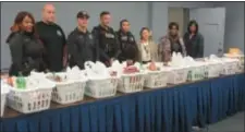  ??  ?? Trenton Police organized the annual Thanksgivi­ng meal giveaway providing meal baskets for 88 Trenton families.