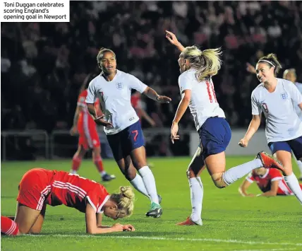  ??  ?? Toni Duggan celebrates scoring England’s opening goal in Newport