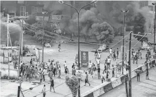  ?? REUTERS ?? People gather in a plaza in Lagos, Nigeria.