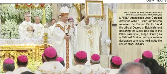  ?? PHOTOGRAPH BY JOEY SANCHEZ MENDOZA FOR THE DAILY TRIBUNE @tribunephl_joey ?? MANILA Archbishop Jose Cardinal Advincula with Fr. Rufino ‘Jun’ Sescon receive from Bishop Pablo David the official Decree of Establishm­ent declaring the Minor Basilica of the Black Nazarene (Quiapo Church) as a National Shrine during a solemn declaratio­n ceremony held inside the church on 29 January.