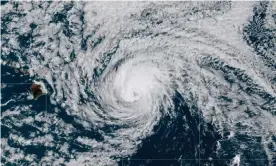  ??  ?? Satellite image of Hurricane Douglas. The storm was about 185 miles east of Honolulu, moving west-north-west at 16mph on Sunday. Photograph: AP