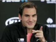  ?? VINCENT THIAN - THE ASSOCIATED PRESS ?? Roger Federer gestures during a press conference following his semifinal win over Hyeon Chung at the Australian Open tennis championsh­ips in Melbourne, Australia, Friday.