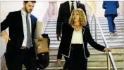  ?? ARVIN TEMKAR/ARVIN.TEMKAR@AJC.COM ?? U.S. Rep. Lucy McBath leaves the Georgia Capitol on Monday after signing paperwork to qualify for reelection.