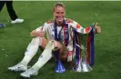  ?? Lander/Copa/Getty Images ?? Lyon’s Amandine Henry, pictured with the Champions League trophy in May, is not part of France’s squad. Photograph: Harriet