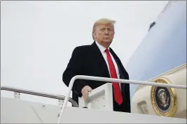  ?? EVAN VUCCI — THE ASSOCIATED PRESS ?? President Donald Trump boards Air Force One for a trip to Miami to attend the Republican National Committee winter meetings, Thursday in Andrews Air Force Base, Md.