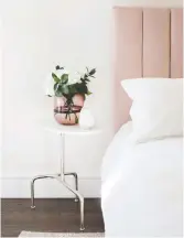  ?? URBAN BARN ?? Flowers on a space-saving side table add the fresh fragrance of summer.