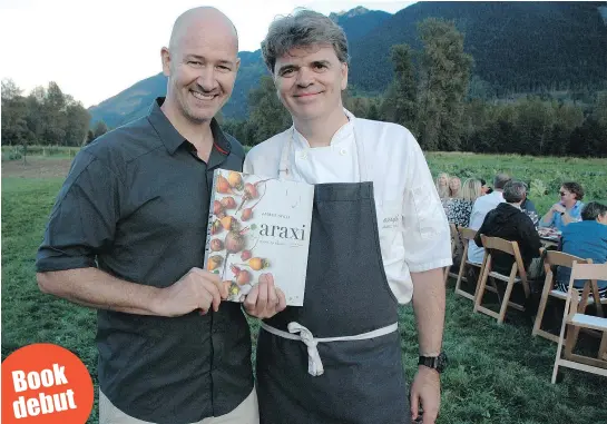  ??  ?? Araxi executive chef James Walt, right, and restaurant director Neil Henderson host the largest longtable dinner in B.C. history. They’re holding Walt’s new cookbook Araxi: Roots to Shoots, Farm Fresh Recipes. Book debut