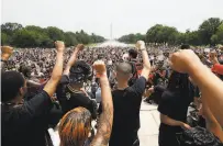  ?? Alex Brandon / Associated Press ?? Crowds gather at Washington’s Lincoln Memorial, one of the nationwide protests over the death of George Floyd.