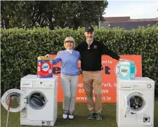  ??  ?? Joint winners of the washing machine challenge, Captain of the Ladies team Margaret Conlon and Captain of the men’s Tom Horkan with their trophy box of washing powder. Pic: Frances Muldoon.