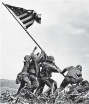  ?? JOE ROSENTHAL/AP ?? Marines raise the American flag Feb. 23, 1945, atop Mount Suribachi in the Battle of Iwo Jima, which lasted 36 days.