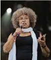  ?? DAVID BARNES / SPECIAL TO AJC ?? Angela Davis speaks at the Many Rivers to Cross Music and Arts Festival in Fairburn in 2016. Social justice was one of the festival’s themes.