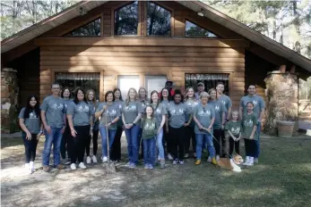  ?? (Matt Hutcheson/News-Times) ?? Camp Fire members and administra­tors gathered at Camp Wotapi on Monday to break ground on an expansion project for the campground cabin.