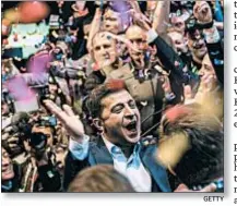  ?? GETTY ?? Volodymyr Zelenskiy celebrates his apparent victory in Ukraine’s presidenti­al race.