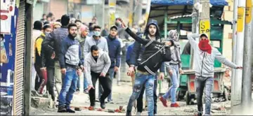  ?? HT FILE ?? ■ Protestors throw stones at soldiers during clashes in Srinagar on February 26 over raids on the houses of separatist­s. Experts say tensions in the Valley have spiked following the Pulwama terror attack, and campaignin­g won’t be easy, especially in south Kashmir.