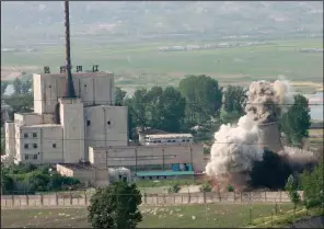  ?? (AP file photo) ?? In June 2008, the cooling tower of the Yongbyon nuclear complex is demolished in Yongbyon, North Korea.