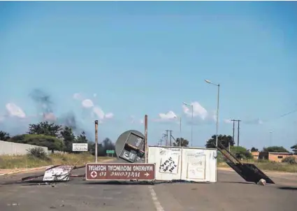  ??  ?? Ailing province: The health go-slow in North West was compounded this week when anti-corruption protesters in Mahikeng blockaded roads with rocks and burning tyres. Photo: Oupa Nkosi