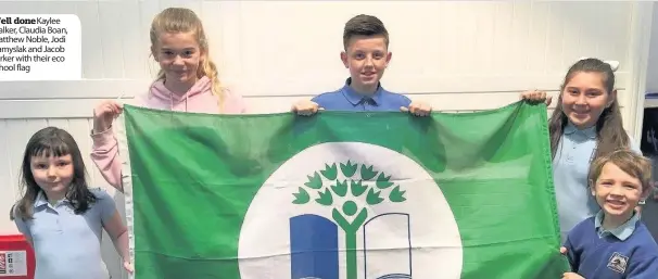  ??  ?? Well doneKaylee Walker, Claudia Boan, Matthew Noble, Jodi Namyslak and Jacob Parker with their eco school flag