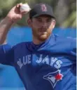  ??  ?? Joe Biagini and the Jays joined MLB teams in wearing caps to remember Stoneman Douglas victims.