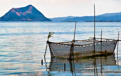  ??  ?? Fishkills, the presence of piggeries and huge real estate developmen­ts have contribute­d to the deteriorat­ing water quality of Taal Lake.