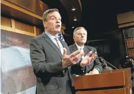  ?? J. SCOTT APPLEWHITE/ASSOCIATED PRESS ?? Sens. Mark Waner, left, and Richard Burr, who lead the Senate Intelligen­ce Committee, brief reporters Wednesday on plans for the probe into Russian interventi­on in the 2016 election.