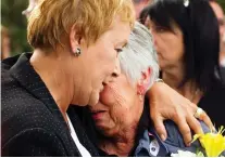  ?? RYAN REMIORZ/THE CANADIAN PRESS ?? Then-premier-elect Pauline Marois, left, comforts Ginette Jean, mother of election-night shooting victim Denis Blanchette, during funeral services in Montreal in 2012.