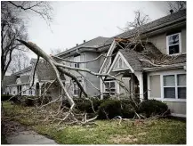  ?? MARSHALL GORBY/STAFF ?? A large tree fell into one of the apartments on Spinning Road at The Properties at Wright Field after strong winds blew through the area Wednesday morning.