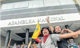  ?? /AFP ?? Backlash: Protesters outside the national assembly in Quito, Ecuador, during clashes with riot police on Tuesday. Citizens are unhappy at the surge in fuel prices after the scrapping of subsidies.