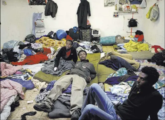  ?? Tara Todras-Whitehill The Associated Press ?? Eritrean refugees in a shelter in Tel Aviv, Israel. The Middle Eastern country has become a prime destinatio­n for fleeing Eritreans.