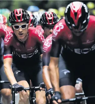  ??  ?? Geraint Thomas, left, with his Ineos teammates during the Tour de France in July last year