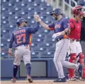  ?? JEFF ROBERSON/ASSOCIATED PRESS ?? The Astros’ Steven Souza Jr., right, is congratula­ted by teammate Jose Altuve after Souza hit a two-run home run during Monday’s spring training game in West Palm Beach, Fla.