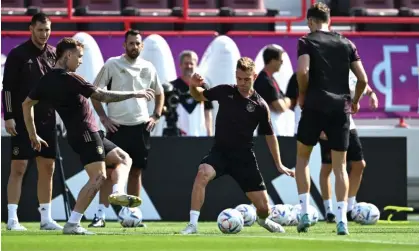  ?? Photograph: Ina Fassbender/AFP/Getty Images ?? Joshua Kimmich (centre) takes part in Germany’s training session as they prepare for their opening game against Japan.