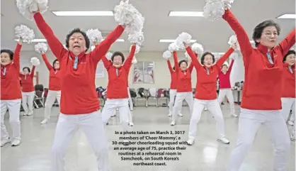  ??  ?? In a photo taken on March 3, 3017 members of ‘Cheer Mommy’, a 30-member cheerleadi­ng squad with an average age of 75, practice their routines at a rehearsal room in Samcheok, on South Korea’s northeast coast.