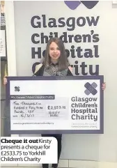  ??  ?? Cheque it out Kirsty presents a cheque for £2533.75 to Yorkhill Children’s Charity