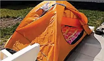  ??  ?? FAMILY FIRST . . . Eugene, a nurse in Austria used a tent for self isolation at home when he contracted Covid-19 at his workplace