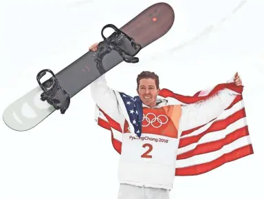  ?? JACK GRUBER/USA TODAY SPORTS ?? Shaun White celebrates winning gold in the men’s snowboardi­ng halfpipe on Wednesday.