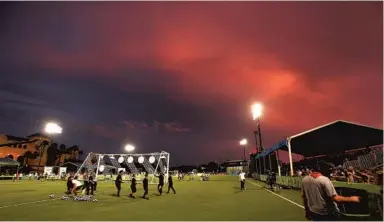  ?? STEPHEN M. DOWELL/ORLANDO SENTINEL ?? Crews move nets across the pitch during the MLS All-Star Skills Challenge at ESPN Wide World of Sports on July 30, 2019. MLS will return to the venue to host a World Cup style tournament in July.