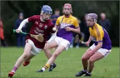  ??  ?? Conor Devereux (St. Martin’s) taking on Ben Hynes (Faythe Harriers).