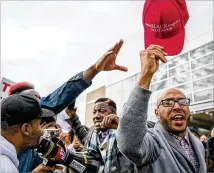  ?? ALYSSA POINTER / ALYSSA.POINTER@AJC.COM / 2019 ?? Trump supporter Tony Smith (right), of College Park, yells “Trump 2020” amid a crowd of anti-Trump protesters as they rallied outside the Georgia World Congress Center in downtown Atlanta on Nov.8 when the president visited.