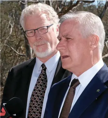  ?? Photo: Matthew Newton ?? ON THE JOB: Australian Rail Track Corporatio­n Inland Rail Program CEO Richard Wankmuller (left) and Deputy Prime Minister Michael McCormack talk up the benefits of the Inland Rail project at a press conference in Toowoomba on Thursday.