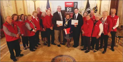  ?? Submitted photo ?? ABOVE: State Sen. Roger Picard, center, received the Capital Caregivers award Tuesday from the American Associatio­n of Retire Persons. With him are AARP Statehouse advocacy volunteers. AARP RI Advocacy Director John DiTomasso is on the far...