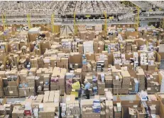  ??  ?? The busy warehouse floor at Amazon