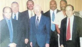  ?? ?? General Colin Powell (second left), Jimmy Carter (centre), boxer Evander Holyfield (third right), Retired Lt Col Bruce Barclay (second right) of the Jamaica Defence Force, along with two other members of the Carter Foundation who observed the 1997 elections in Jamaica.