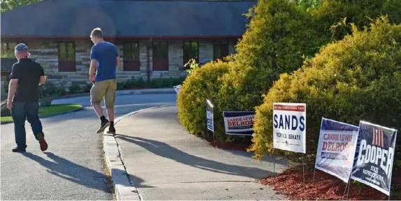  ?? Shannon M Venditti photos ?? Voters leave Newlonsbur­g Presbyteri­an Church after casting their vote in the Pennsylvan­ia primary.