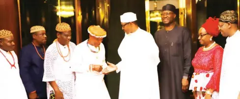  ?? Photo: Felix Onigbinde ?? President Muhammadu Buhari (4th right) in a handshake with the leader of a delegation from Ugep Kingdom in Cross River State, His Royal Highness, Obol Ofem Ubana, Obol Lopon of Ugep, during the delegation’s visit to the State House in Abuja yesterday. With them is the Secretary to the Government of the Federation, Boss Mustapha (3rd right); Head of Civil Service of the Federation, Mrs Winifred Ekanem Oyo-Ita (2nd right) and Minister of Informatio­n and Culture, Alhaji Lai Mohammed (right)