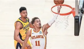  ?? DALE ZANINE/USA TODAY SPORTS ?? Hawks guard Trae Young scored 34 points in a win over the Pacers on Sunday.